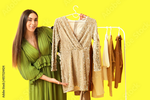 Female stylist with clothes...