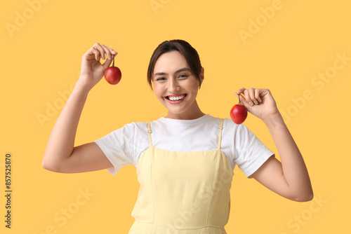 Smiling young woman holding...