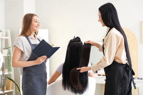 Female hairdresser with ass...