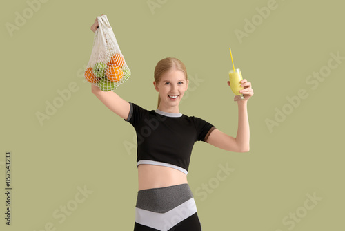 Happy sporty young woman wi...