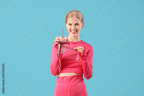 Happy sporty young woman wi...