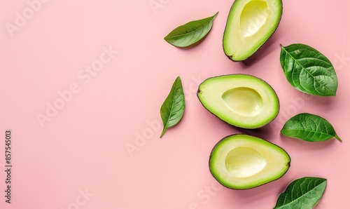 Wallpaper Mural Sliced avocado with leaves on a pastel pink background Torontodigital.ca