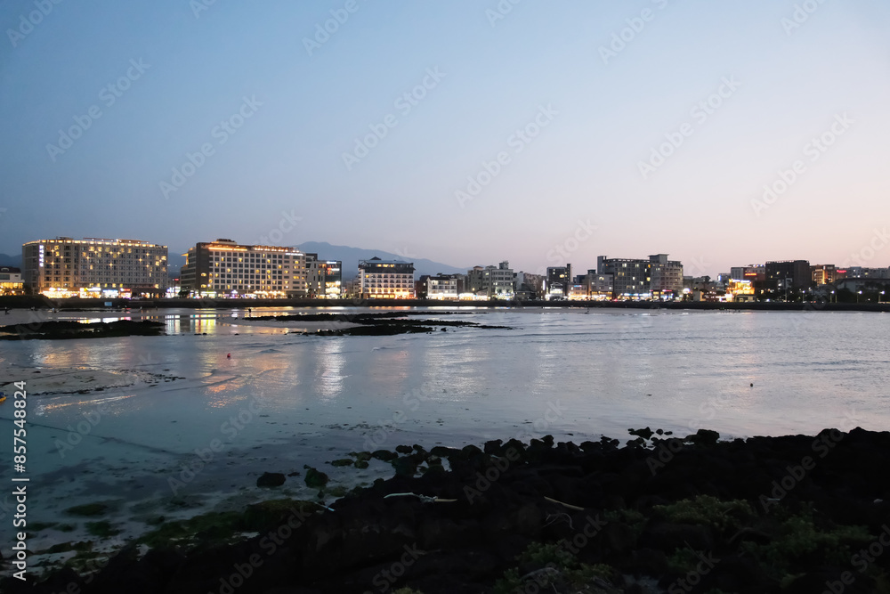 evening dusk at at Hamdeok beach in Jeju island, South Korea evening dusk at at Hamdeok beach in Jeju island, South Korea