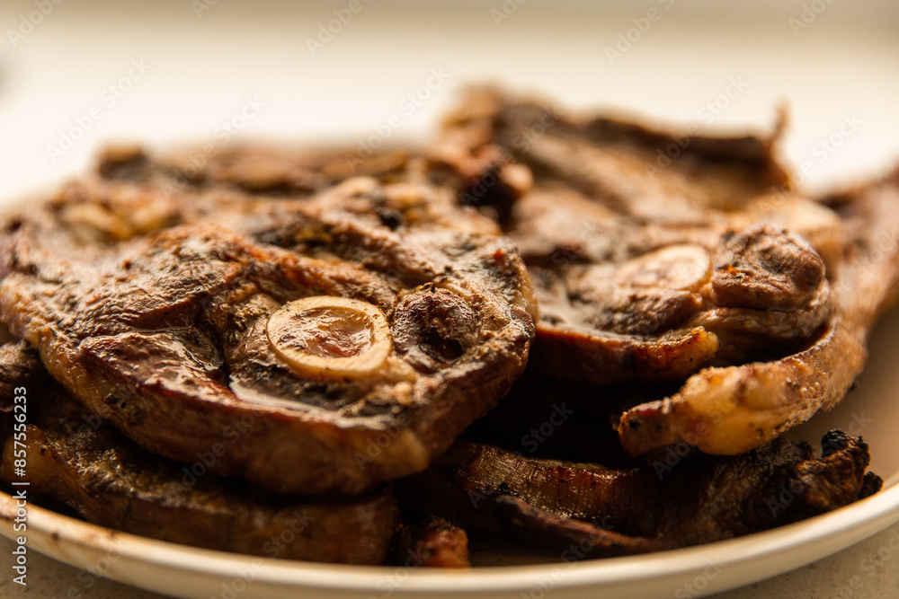 close up of lamb chops with bone marrow on a plate close up of lamb chops with bone marrow on a plate