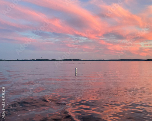 Lake Buoy with Colorful Sunset over Lake Mendota on the Boat photo