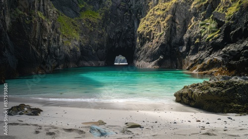 A beautiful beach with a small body of water and a rock in the middle