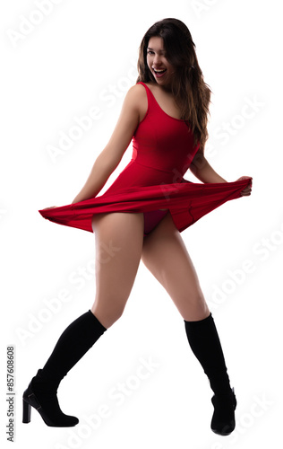 Joyful young woman twirling in red dress