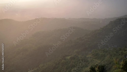 sunset view on the cumbri hills, wonogiri, central java photo