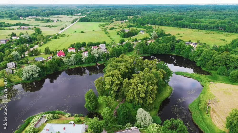 Aerial View Over Dundaga Town, Latvia. Medieval Dundaga Castle With Park and Lake. Old Lutheran Church and Cityscape of the Dundaga City Panorama. Landscape Design, Travel Destination in Latvia Aerial View Over Dundaga Town, Latvia. Medieval Dundaga Castle With Park and Lake. Old Lutheran Church and Cityscape of the Dundaga City Panorama. Landscape Design, Travel Destination in Latvia