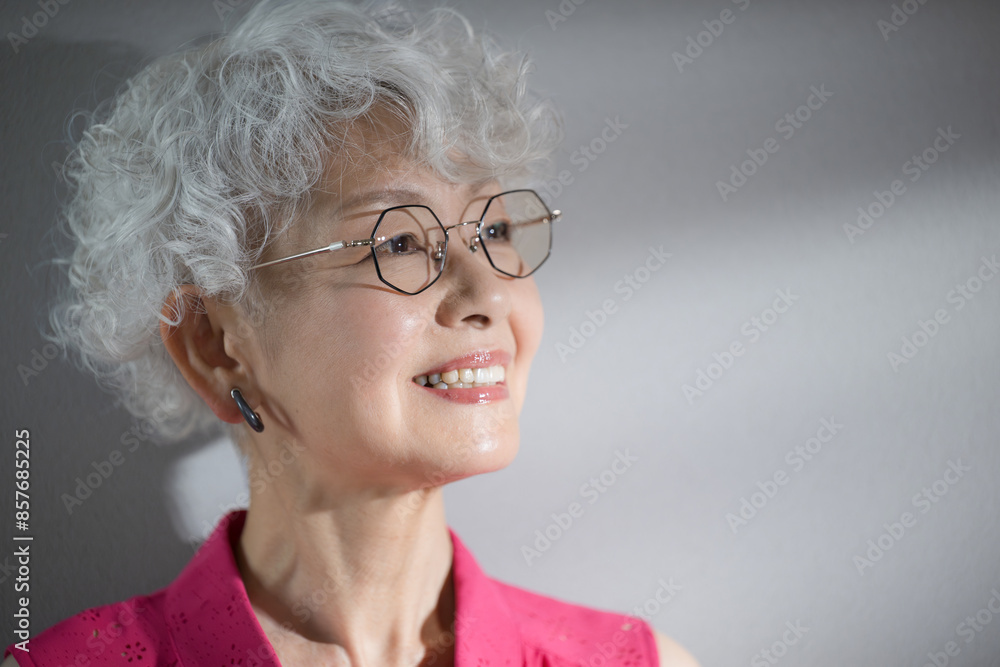 Close-up of a woman with gray hair looking up Skin care, hair care and beauty image Close-up of a woman with gray hair looking up Skin care, hair care and beauty image