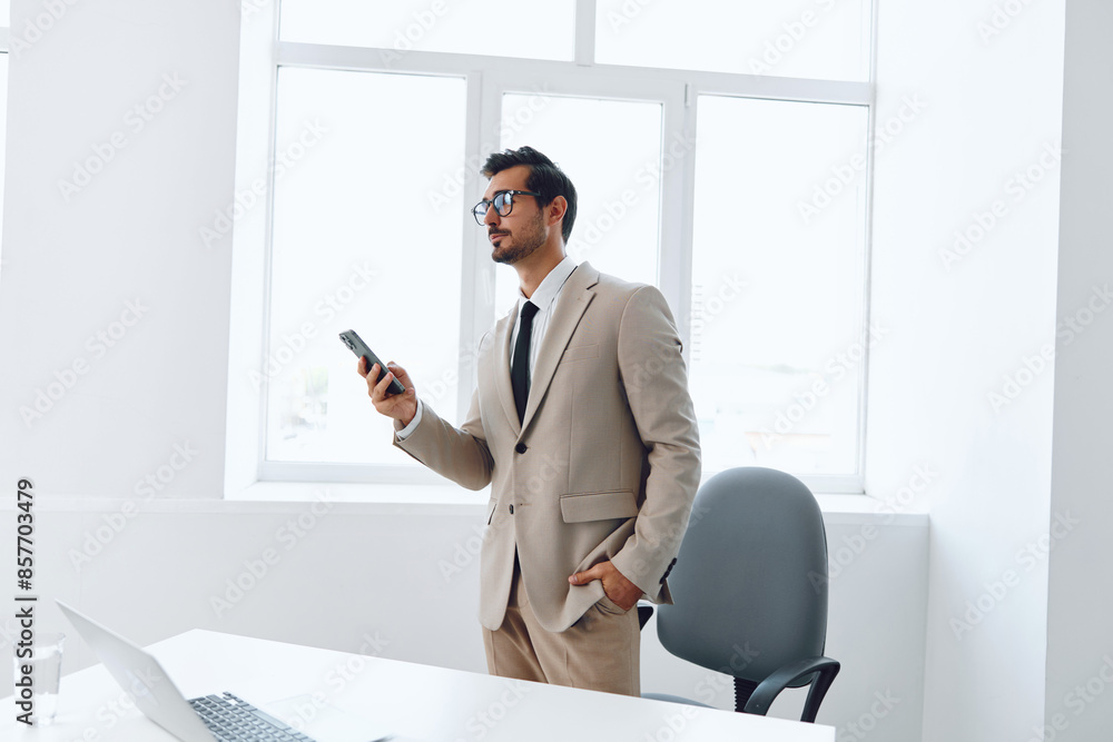 Man smile businessman beige talk winner computer call phone office laptop portrait working video happy Man smile businessman beige talk winner computer call phone office laptop portrait working video happy