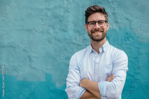 Fototapeta Naklejka Na Ścianę i Meble -  Confident hr professional portrait of a happy man with arms crossed in human resources career