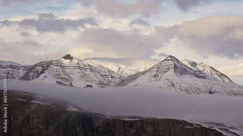 Time-lapse of mountains surrounding the town of Chalten during winter with snow covered peaks. Cerro Piramide, Patagonia Time-lapse of mountains surrounding the town of Chalten during winter with snow covered peaks. Cerro Piramide, Patagonia