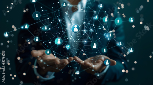 Businessman holding virtual Human Resources network connection icons. Employee Engagement, Talent Management, Workforce Connectivity. Internet business and social network.