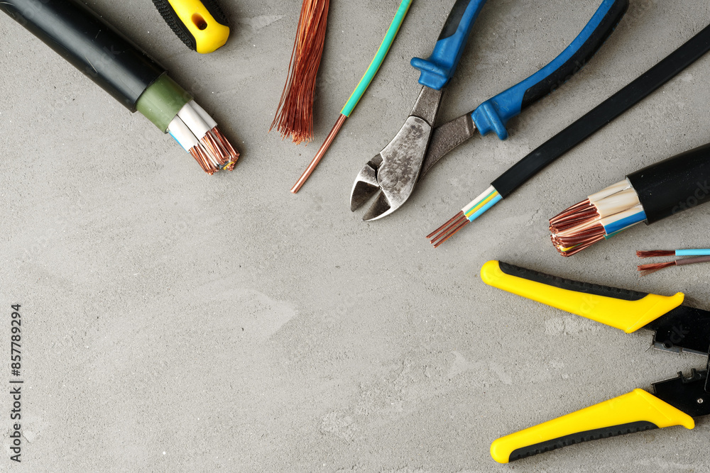 Electrical Tools and Wires on Gray Surface Electrical Tools and Wires on Gray Surface