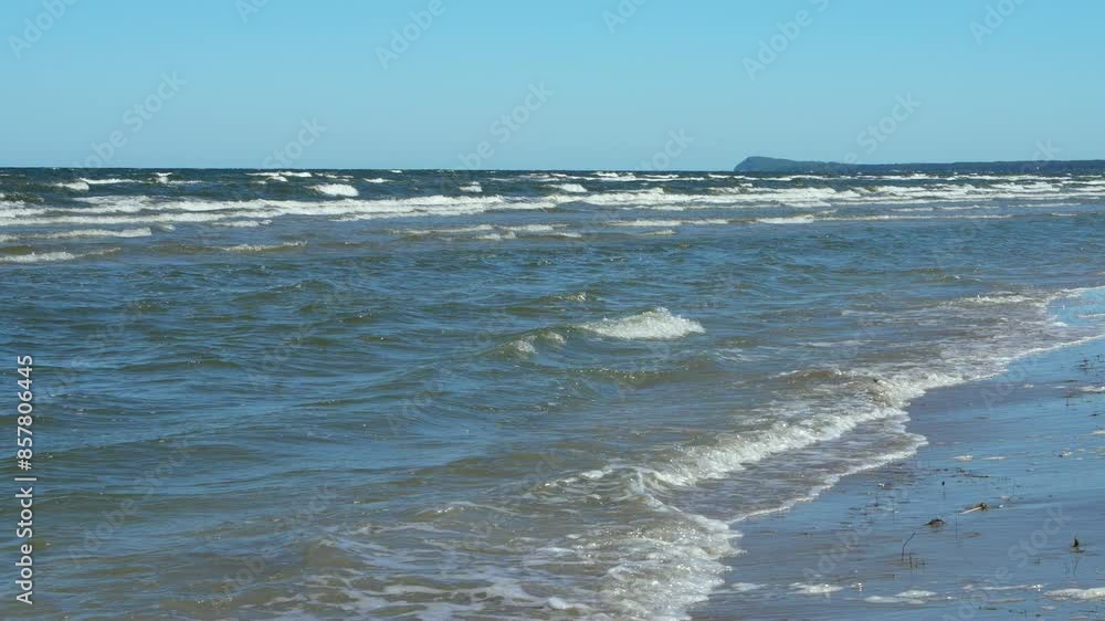 Endless sea waves rush onto the coast on the Baltic Sea. Slow motion. Relaxation, tranquility, pleasure. Holidays at sea Endless sea waves rush onto the coast on the Baltic Sea. Slow motion. Relaxation, tranquility, pleasure. Holidays at sea