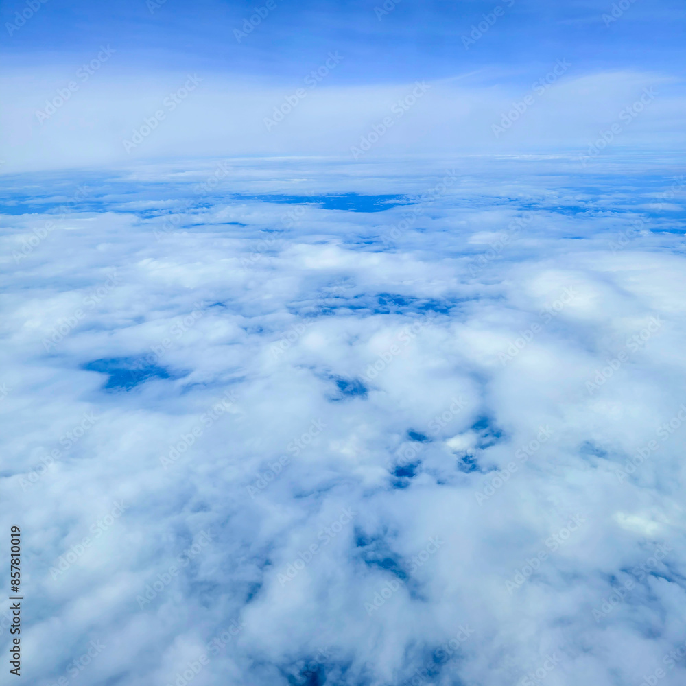 Snowy white clouds in the blue sky on a bright summer day big white clouds textured sky Scenery of fluffy white clouds Wide blue sky natural background. Snowy white clouds in the blue sky on a bright summer day big white clouds textured sky Scenery of fluffy white clouds Wide blue sky natural background.