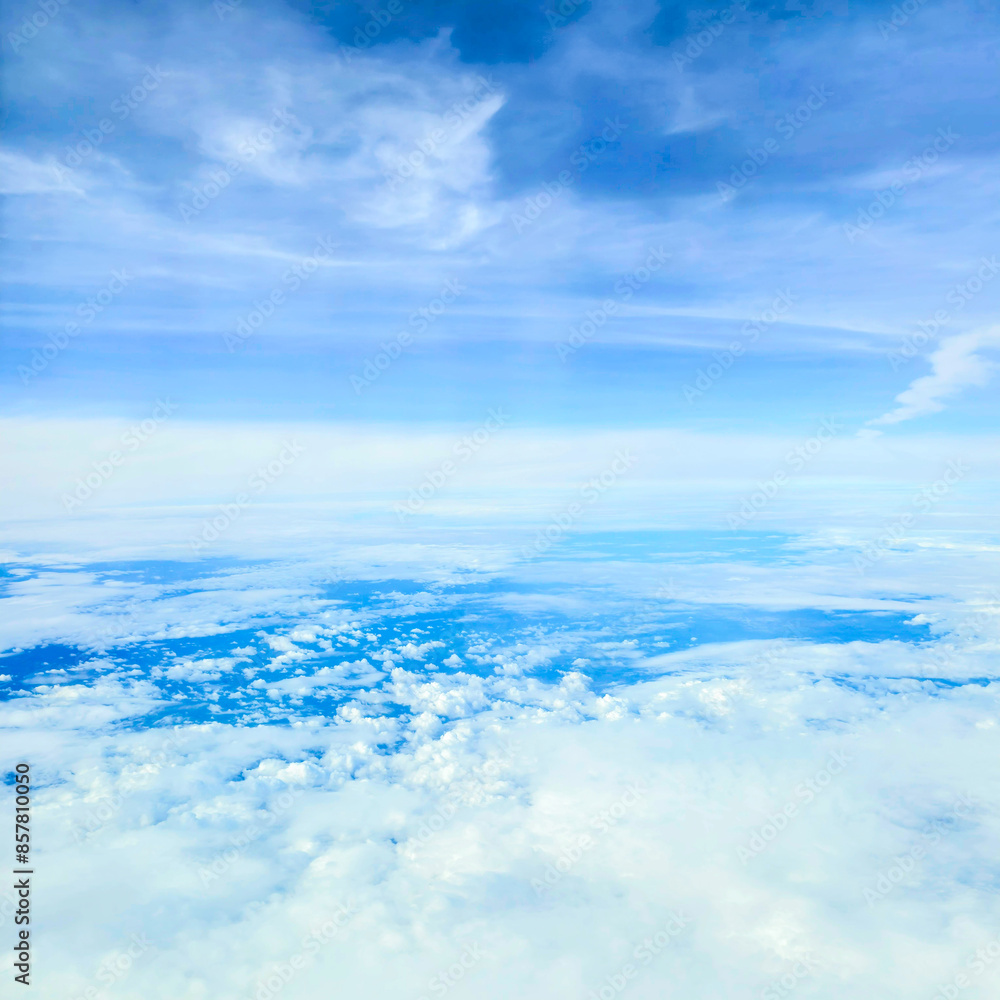 Snowy white clouds in the blue sky on a bright summer day big white clouds textured sky Scenery of fluffy white clouds Wide blue sky natural background. Snowy white clouds in the blue sky on a bright summer day big white clouds textured sky Scenery of fluffy white clouds Wide blue sky natural background.