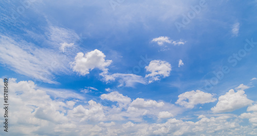clear blue sky background,clouds with background, Blue sky background with tiny clouds. White fluffy clouds in the blue sky.  © pinglabel