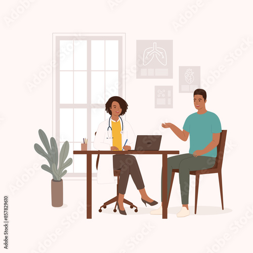 Smiling Black Female Doctor Or General Practitioner Having A Clinical Consultation While Writing Notes For A Young Man Patient At Her Office.