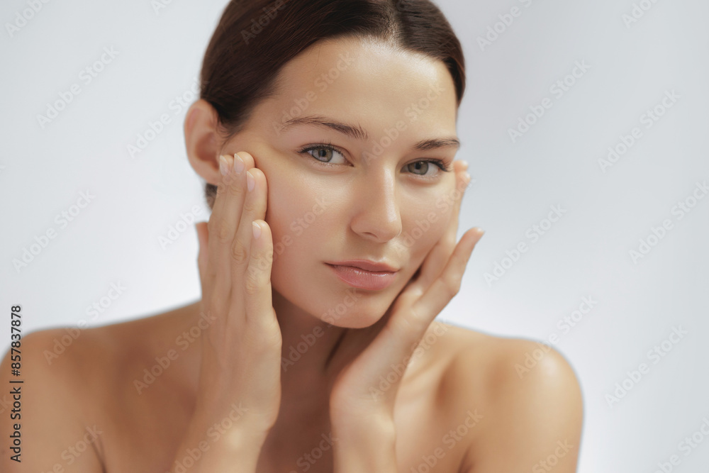 Young Asian Woman Inspecting Skin for Face Lift and Plastic Surgery Young Asian Woman Inspecting Skin for Face Lift and Plastic Surgery