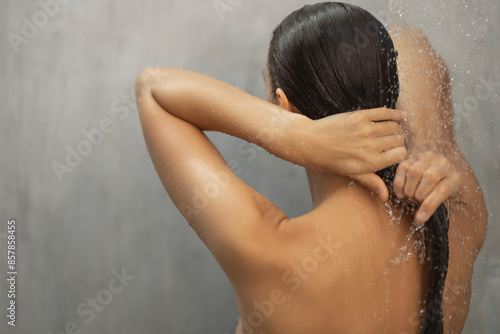 Sensual Shower Moment: Woman Washing Hair in a Luxurious Setting