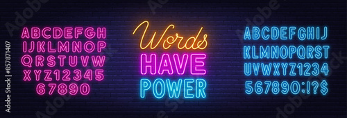 Words Have Power neon lettering on brick wall background
