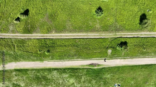 Drone view on Beskid mountains, Mountain biking in the mountains. Summer green forest on Blatnia. Beskid mountains in Jaworze. Drone fly above green mountains in summer and mountain biking. photo