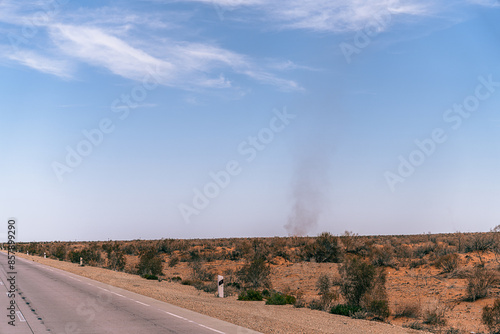 A road with a cloud in the sky photo