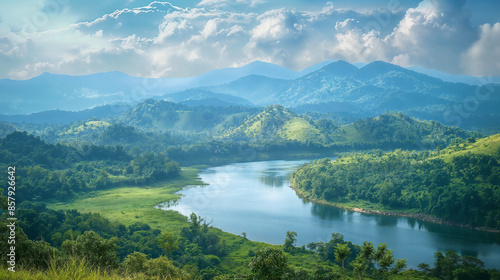 View of a beautiful green landscape with a meandering river and mountains