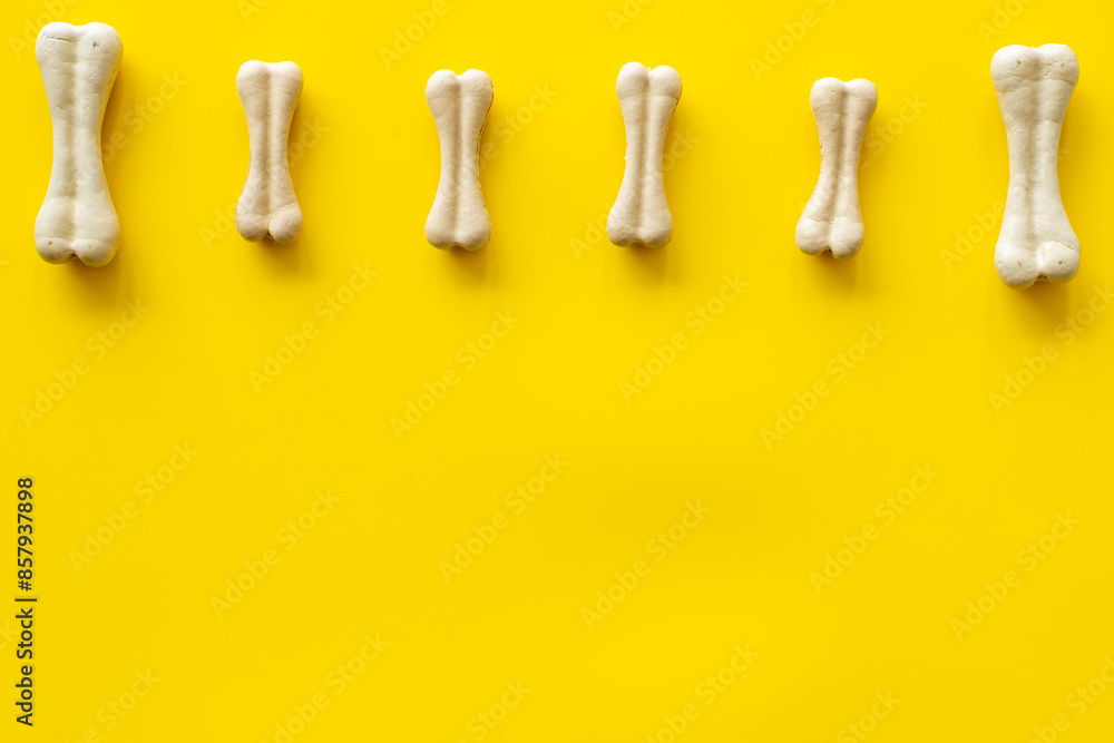 Dog food and treats - chew bones pattern, top view Dog food and treats - chew bones pattern, top view
