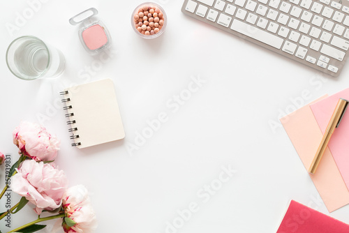 Wallpaper Mural Peony flowers on the office desk table. Female workspace, top view Torontodigital.ca
