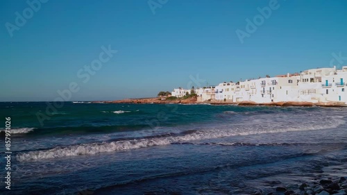 Summer seaview of Naousa of Paros in Greece. Small waves and sunny clear blue sky photo