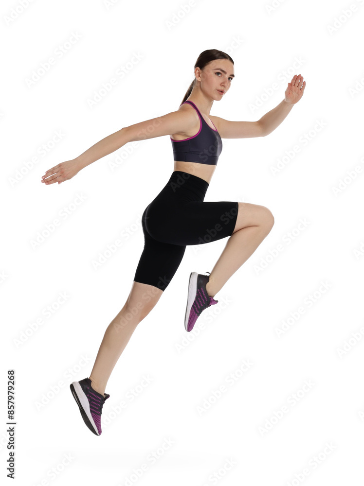 Fototapeta premium Young woman doing aerobic exercise on white background