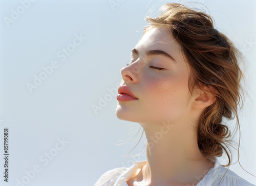 portrait of a clean and beautiful woman with an expression of enjoyment with her eyes closed