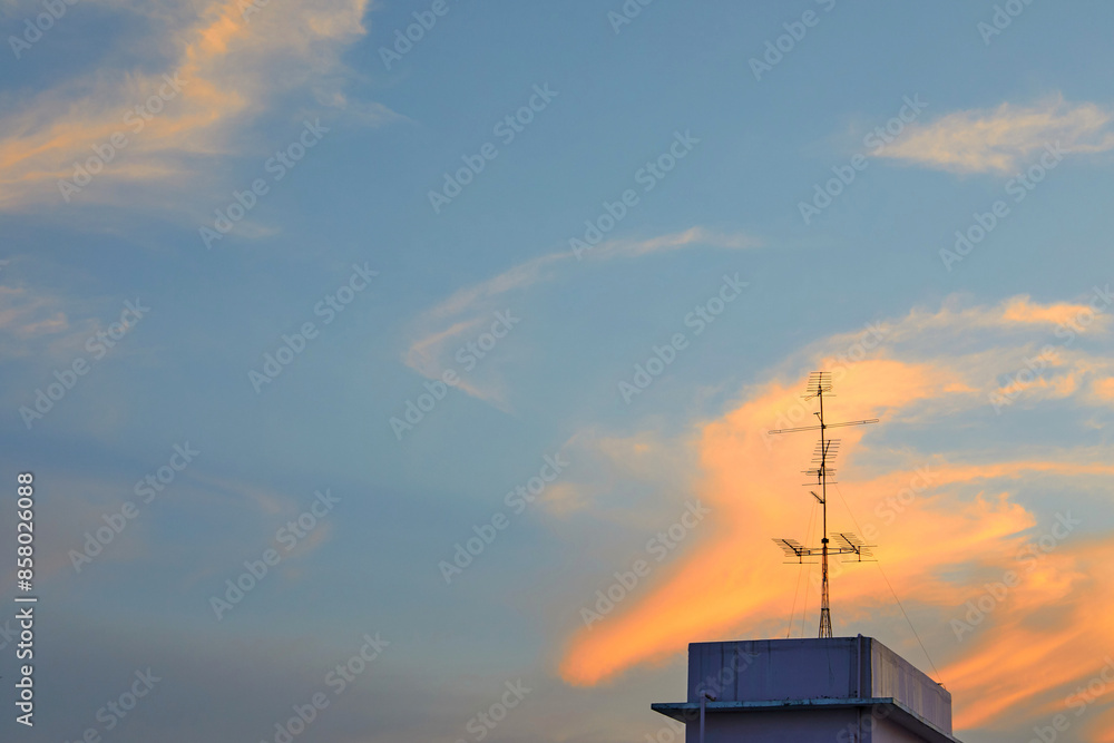 Low angle view of dramatic sky during sunset over the city Low angle view of dramatic sky during sunset over the city