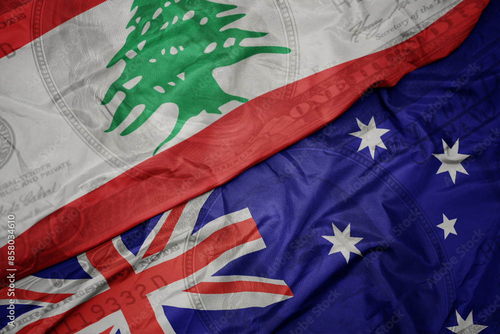 waving colorful flag of lebanon and national flag of australia on the dollar money background. finance concept. waving colorful flag of lebanon and national flag of australia on the dollar money background. finance concept.