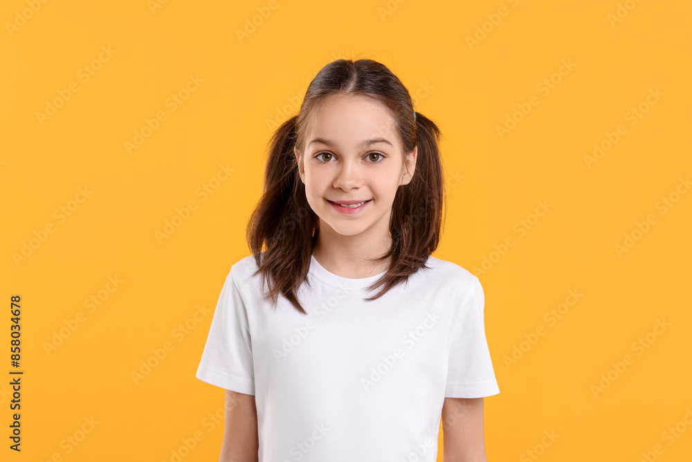 Portrait of beautiful girl on orange background Portrait of beautiful girl on orange background