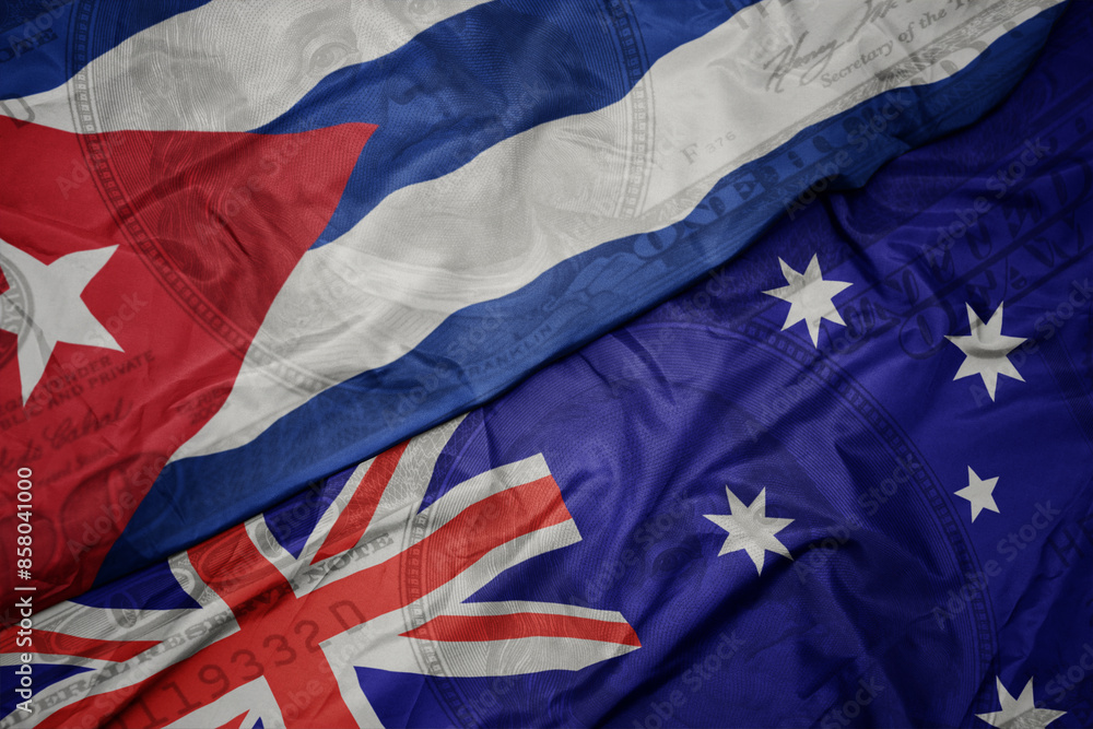waving colorful flag of cuba and national flag of australia on the dollar money background. finance concept. waving colorful flag of cuba and national flag of australia on the dollar money background. finance concept.