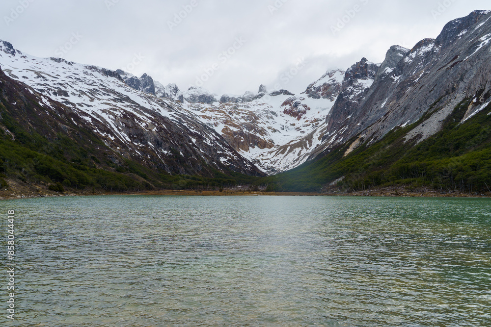 Emerald lagoon landscape, snow-capped Andean mountains in springtime Ushuaia - Argentina, Tierra del fuego Emerald lagoon landscape, snow-capped Andean mountains in springtime Ushuaia - Argentina, Tierra del fuego