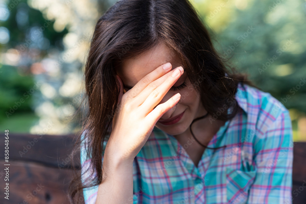 a depressed woman. Depressed woman with head in hands a depressed woman. Depressed woman with head in hands