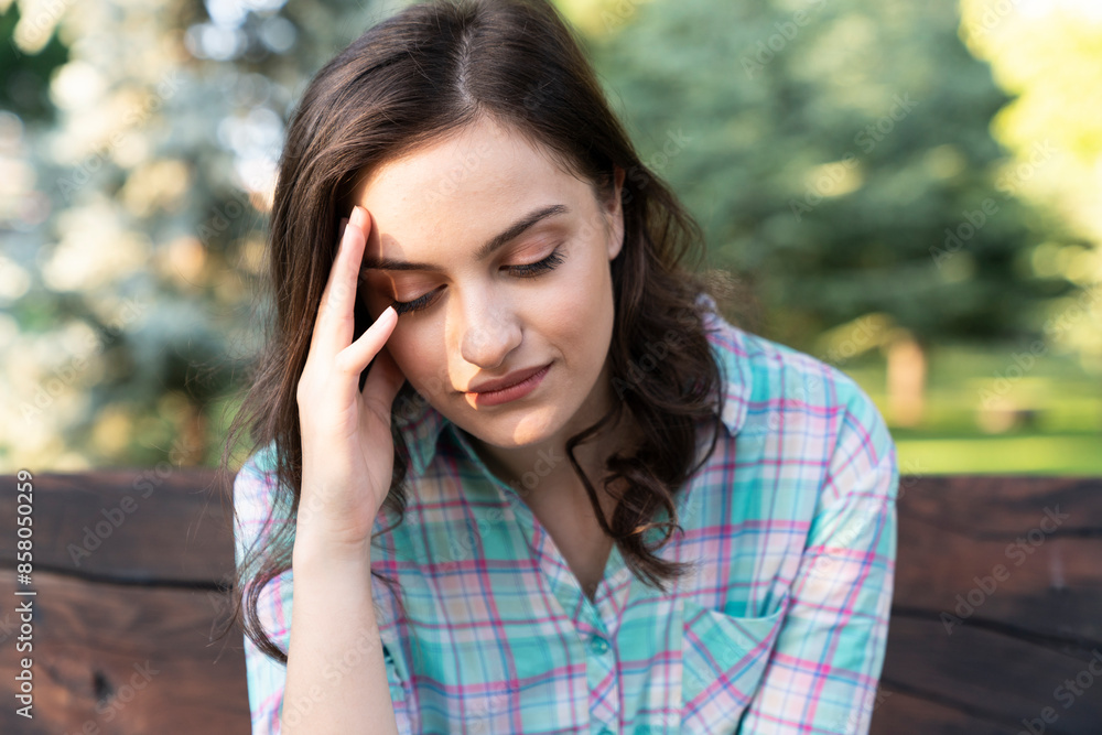 a depressed woman. Depressed woman with head in hands a depressed woman. Depressed woman with head in hands