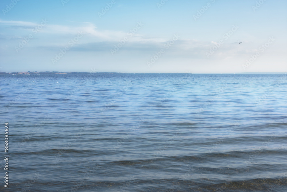 Clouds, blue sky and wallpaper with ocean in nature for outdoor peace, environment and waves. Coast, earth and background of water in sea for climate, scenery and travel destination in Maldives
