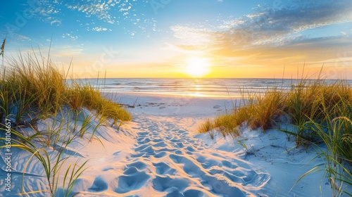 Wallpaper Mural Seaside Sunset: Sand, Grass, and Ocean Waves against a blurry background of beach and sky Torontodigital.ca