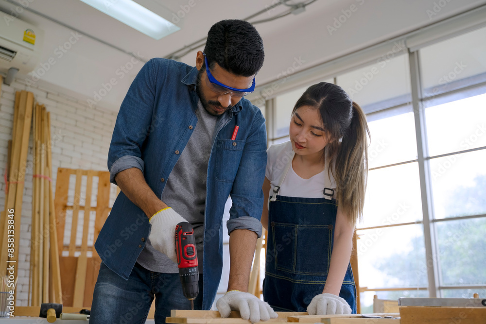 Carpenters are working at woodshop. Carpenters are working at woodshop.