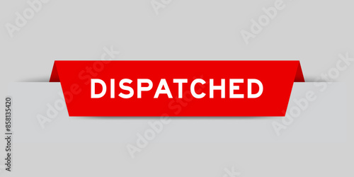 Red color inserted label with word dispatched on gray background