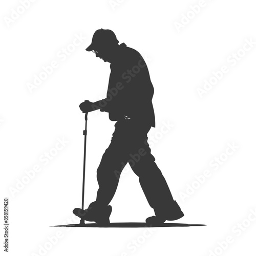 Silhouette of an Elderly Man Walking with a Hiking Stick.