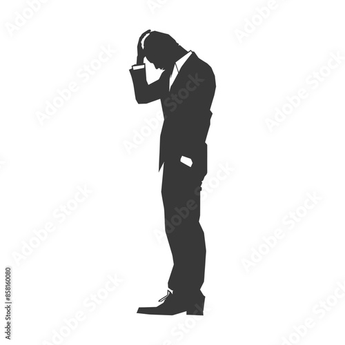 Silhouette of distraught businessman clutching head in despair.