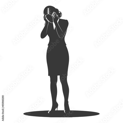 Silhouette of distraught businesswoman covering face with hands, grief concept.