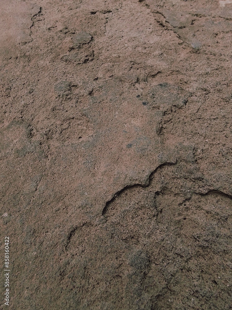 Broken fractured brown stone with a crack in it background, damaged grey uneven disrupted cracked floor Broken fractured brown stone with a crack in it background, damaged grey uneven disrupted cracked floor